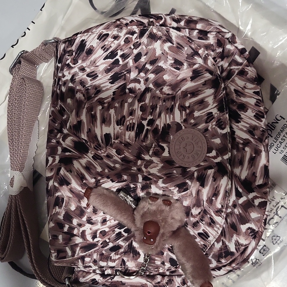 Kipling Crossbody bag10.5 x8.75 x3.25 New never used,brown feathered pattern